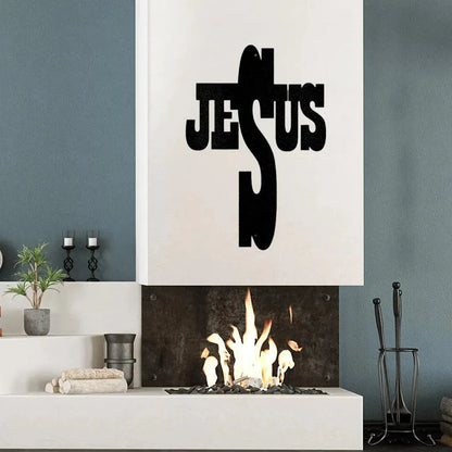Black metal "JESUS" word art cross above a modern fireplace.