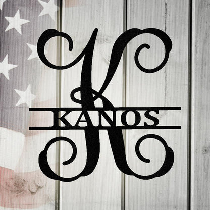 Black metal "K" initial monogram with "KANOS" name, on a rustic wood and American flag background.