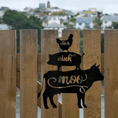Black metal farm animal wall art: stacked cow, pig, and chicken with "moo," "oink," "cluck" cutouts.