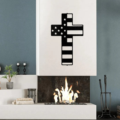 Black metal cross wall art with American flag design above a modern fireplace.