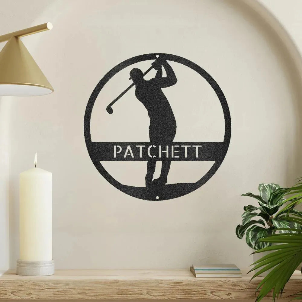 Black metal golfer monogram wall art with "PATCHETT" cut out, mounted on a light wall.