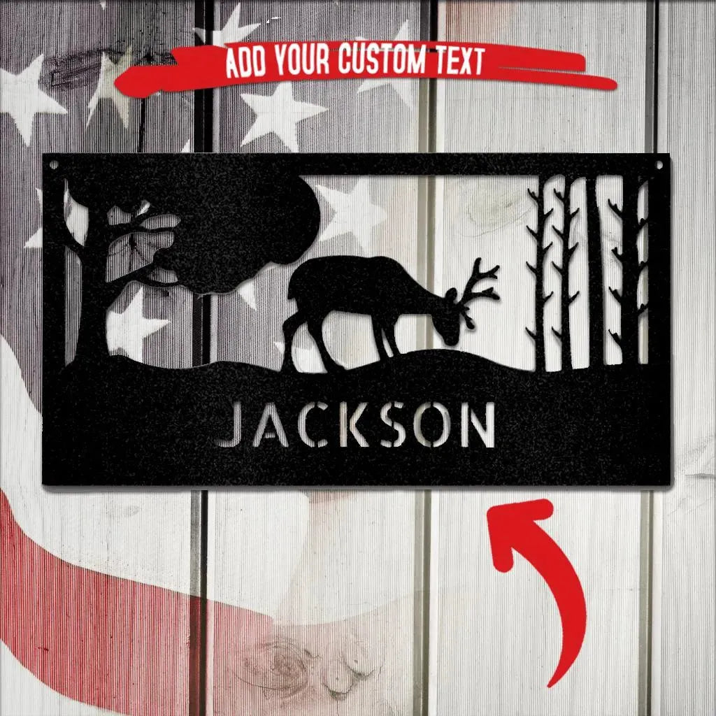 Black metal wall art with a grazing deer, trees, and "JACKSON" custom text.