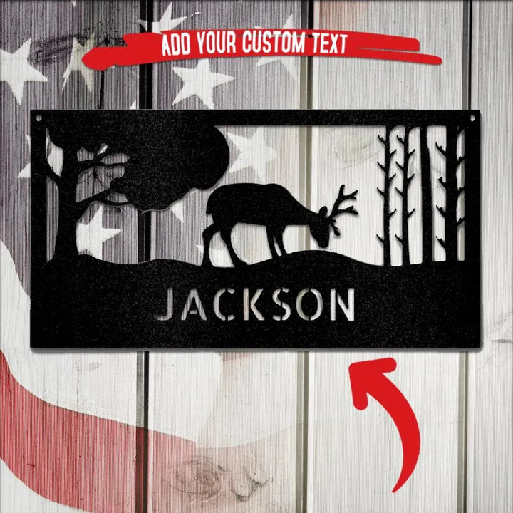 Black metal wall art with a grazing deer, trees, and "JACKSON" custom text.