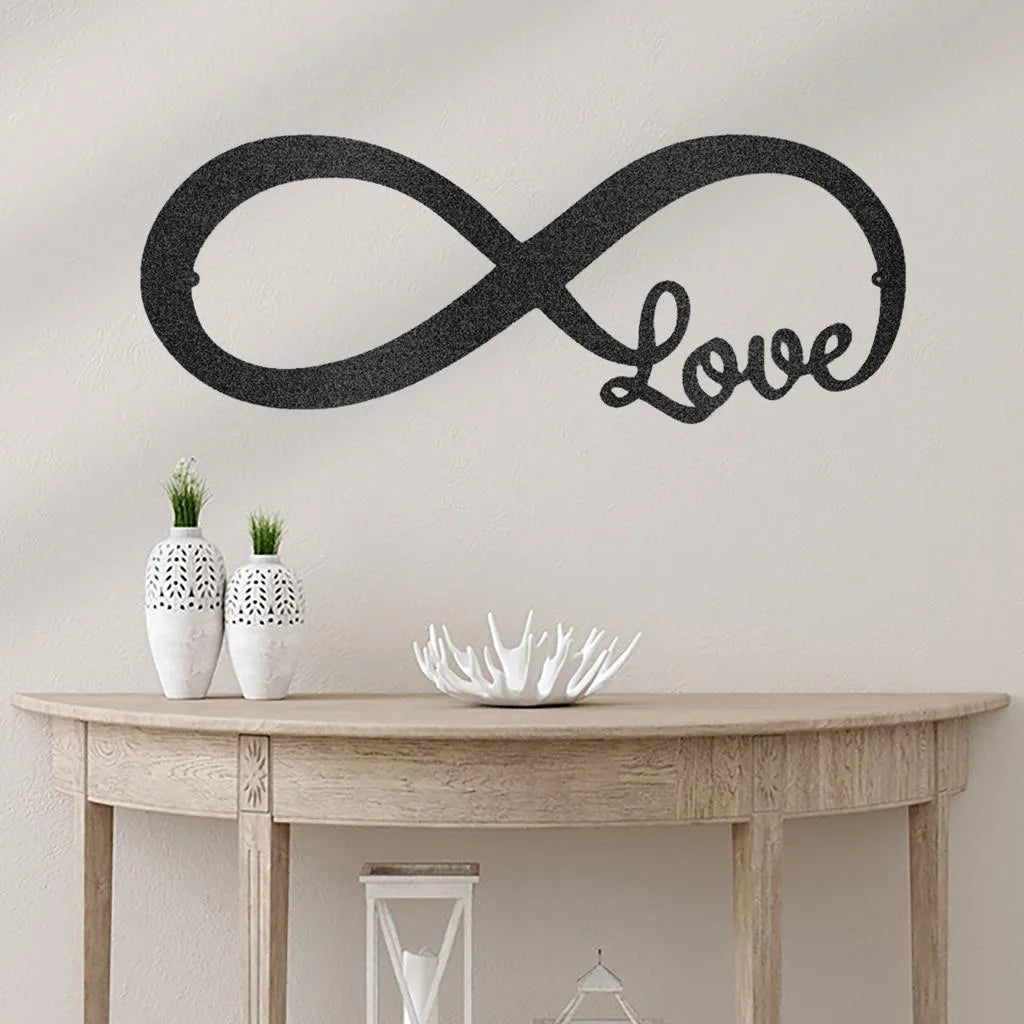 Black metal infinite love wall art, powder-coated steel, mounted above a wooden console table.