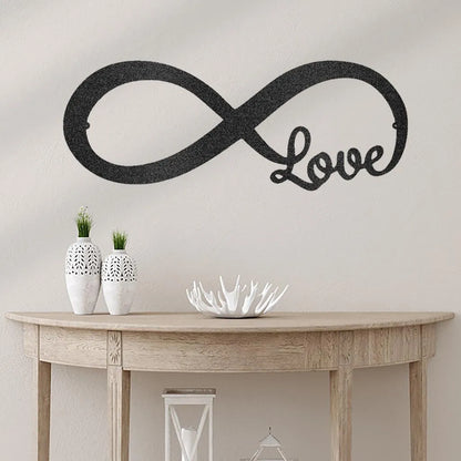 Black metal infinite love wall art, powder-coated steel, mounted above a wooden console table.