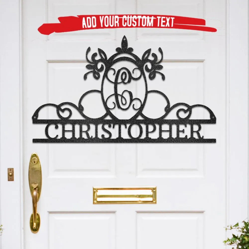 Black metal monogram wall art with ornate initial "C" and "CHRISTOPHER" name, displayed on a white door.
