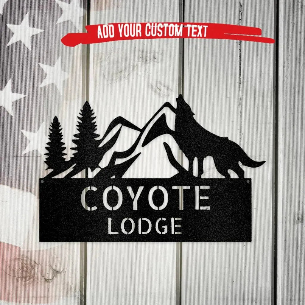 Black metal wall art featuring a howling wolf, mountains, pine trees, and "COYOTE LODGE" text.