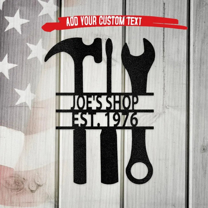 Black metal "Joe's Shop Est. 1976" wall art with hammer, screwdriver, wrench, and other tools.