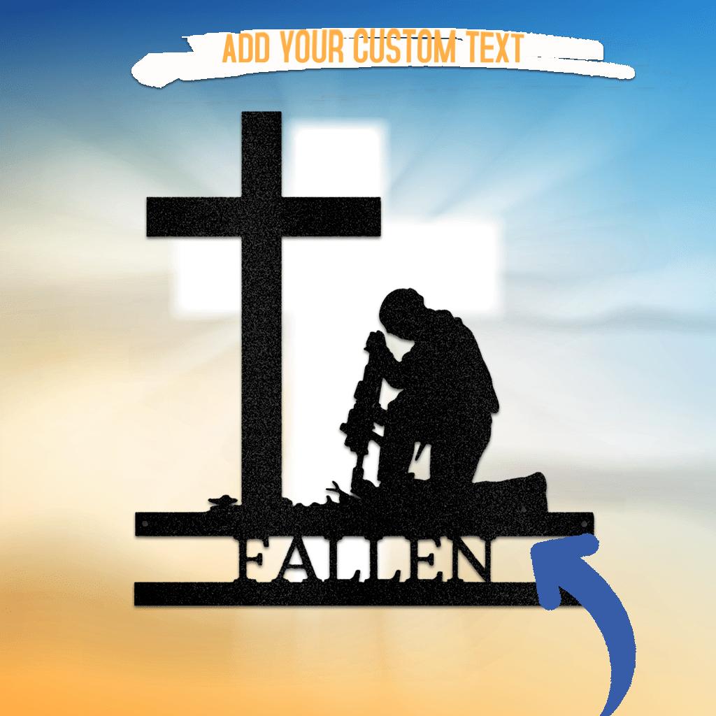 Black metal wall art of a kneeling soldier before a cross, with "FALLEN" text.