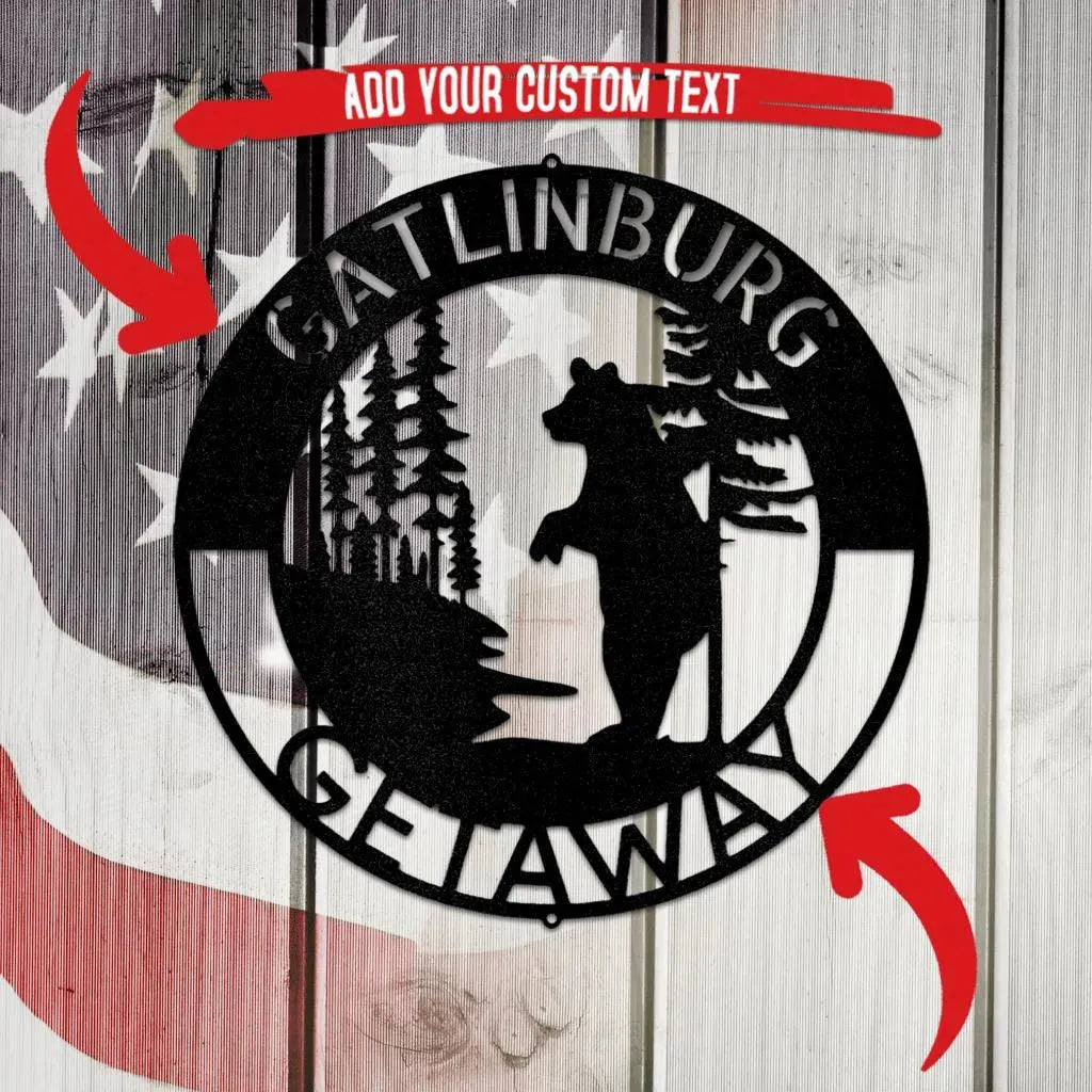 Black metal wall art with a bear, trees, and "Gatlinburg Getaway" text.