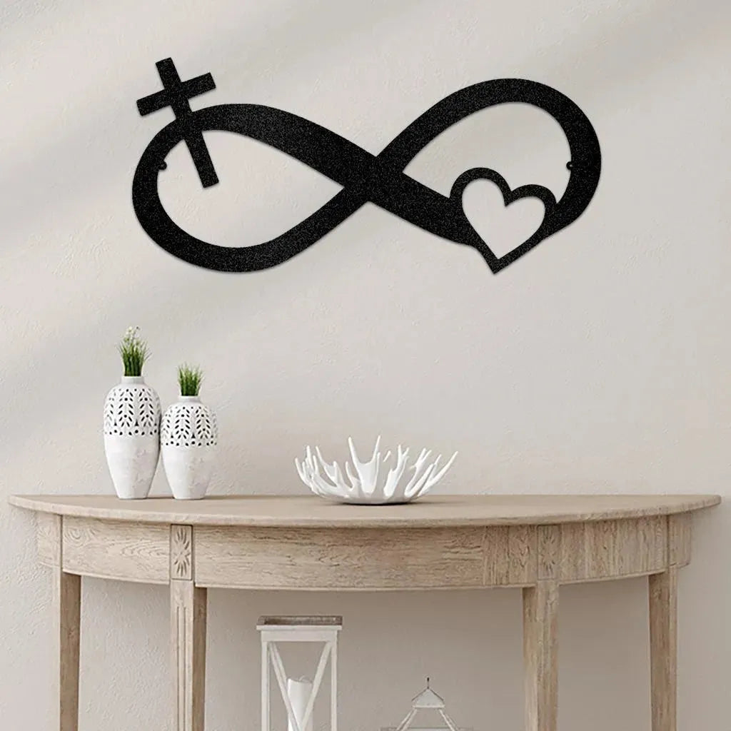 Black metal infinity symbol wall art with a cross and heart design, displayed above a console table.