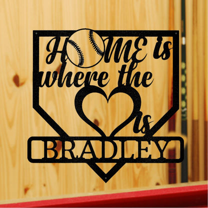 Black metal baseball home plate sign with "HOME is where the heart is BRADLEY" text and a baseball graphic.
