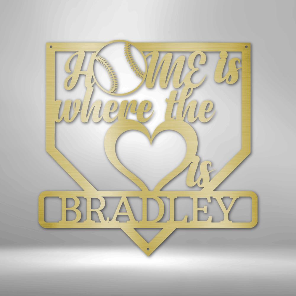 Gold metal baseball home plate sign with "Home is where the heart is" and "BRADLEY" text.