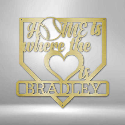 Gold metal baseball home plate sign with "Home is where the heart is" and "BRADLEY" text.