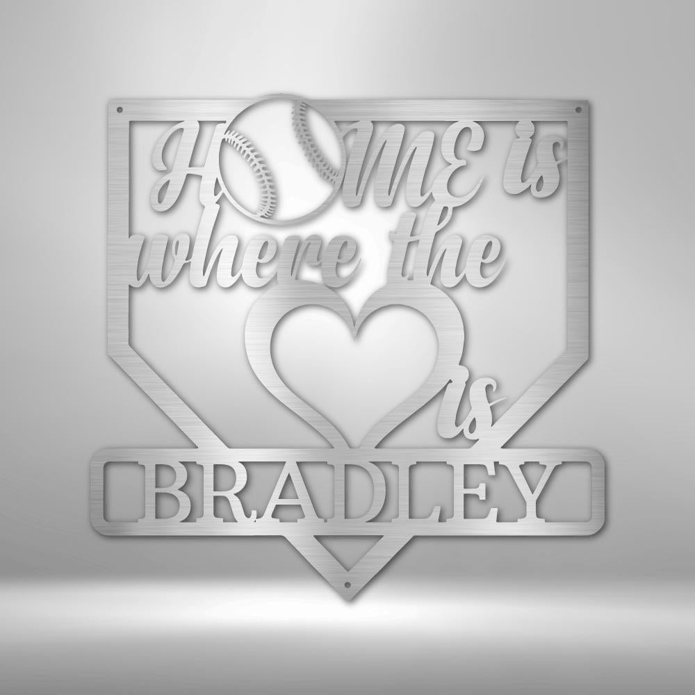 Silver metal baseball home plate sign with "Home is where the heart is" and "Bradley" text.