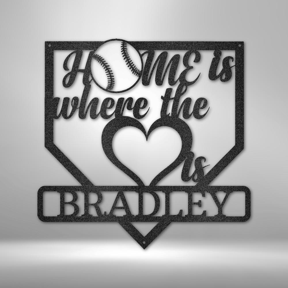 Black metal baseball home plate sign with "Home is where the heart is" and "Bradley" text.