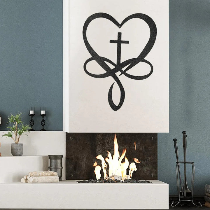 Black metal heart with infinity symbol and cross wall art above a modern fireplace.