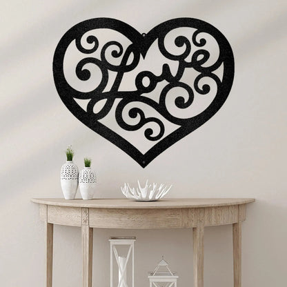 Black metal heart wall art with "Love" in a decorative swirl script, hanging above a wooden console table.