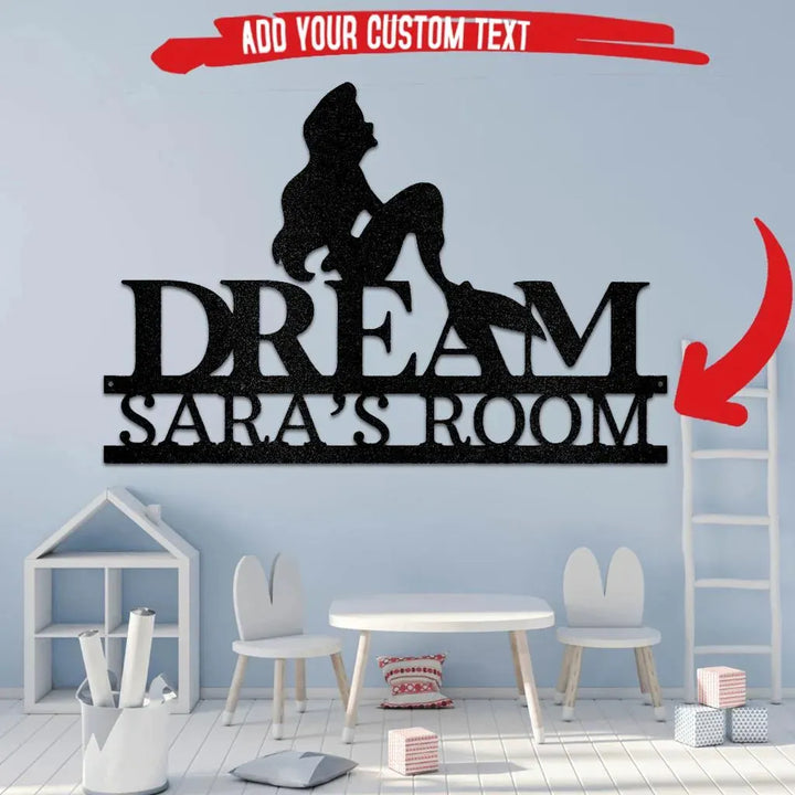 Black metal mermaid silhouette over "DREAM SARA'S ROOM" custom wall art in a child's room.