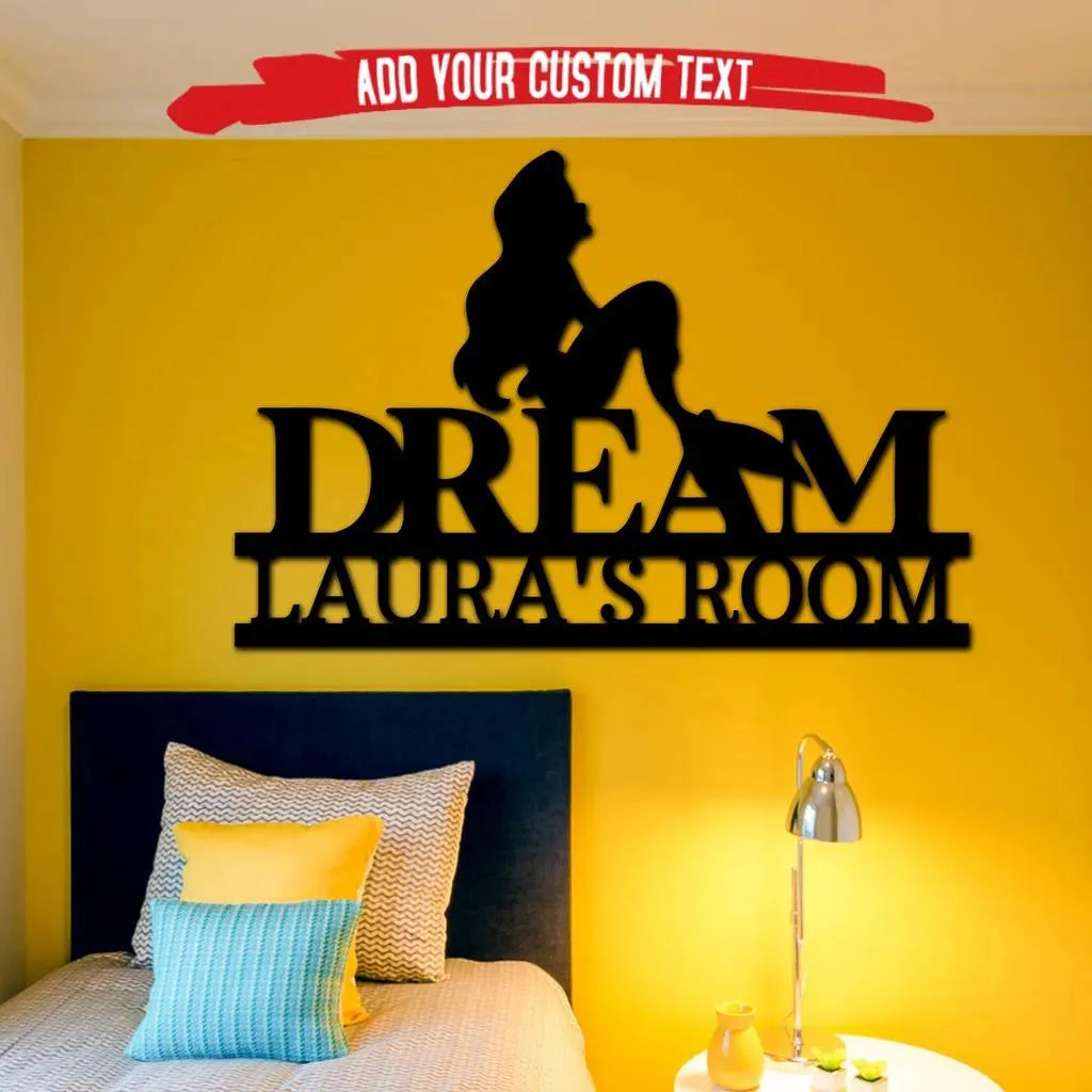 Black metal mermaid silhouette with "DREAM LAURA'S ROOM" custom text on a yellow wall.