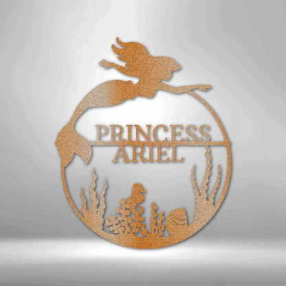 Copper mermaid metal wall art with "Princess Ariel" text, seaweed, and seahorse details.