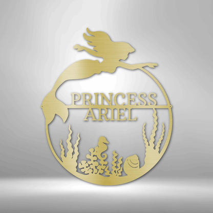 Gold metal mermaid monogram wall art with "PRINCESS ARIEL" name, seahorse, and coral.