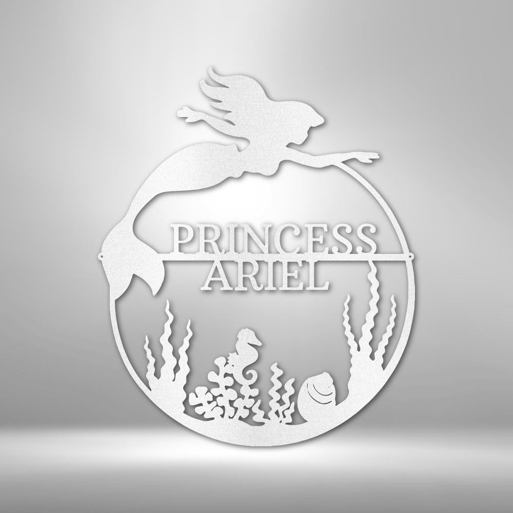 White metal mermaid monogram wall art with "PRINCESS ARIEL" text, seahorse, and coral.