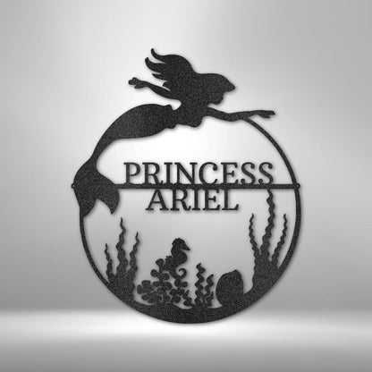 Black metal mermaid monogram wall art with "PRINCESS ARIEL" text, seahorse, and seaweed design.