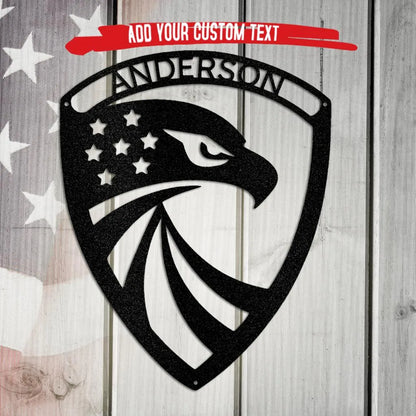 Black metal eagle monogram wall art with stars and "ANDERSON" text on a wood and flag background.