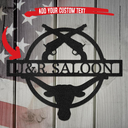 Black metal Old School Saloon Monogram with crossed pistols, custom text, and bull skull design.
