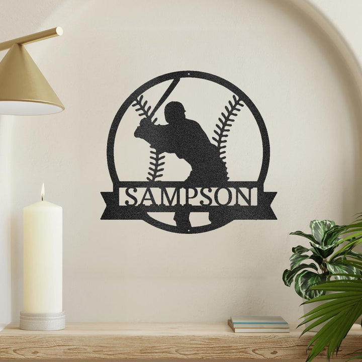 Black metal baseball monogram wall art featuring a batter silhouette and "SAMPSON" in a banner.