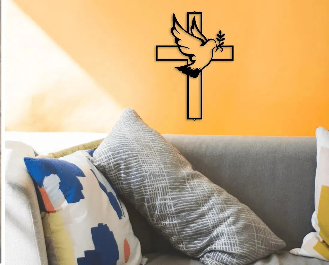 Black metal wall art featuring a cross with a dove holding an olive branch.