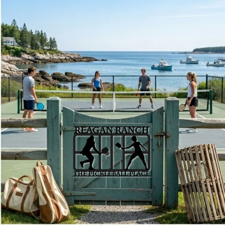 People playing tennis on a court with a 'Reagan Ranch Pickleball Place' sign in the foreground.