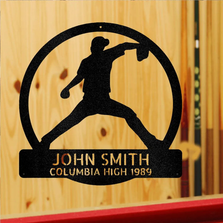 Black metal wall art with a baseball pitcher silhouette in a circle, personalized with "JOHN SMITH COLUMBIA HIGH 1989".