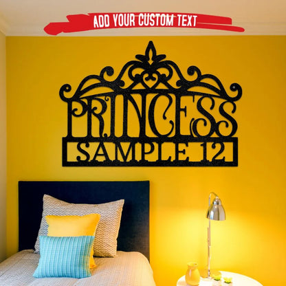 Black metal princess crown monogram wall art with "PRINCESS" and "SAMPLE 12" text on a yellow wall.