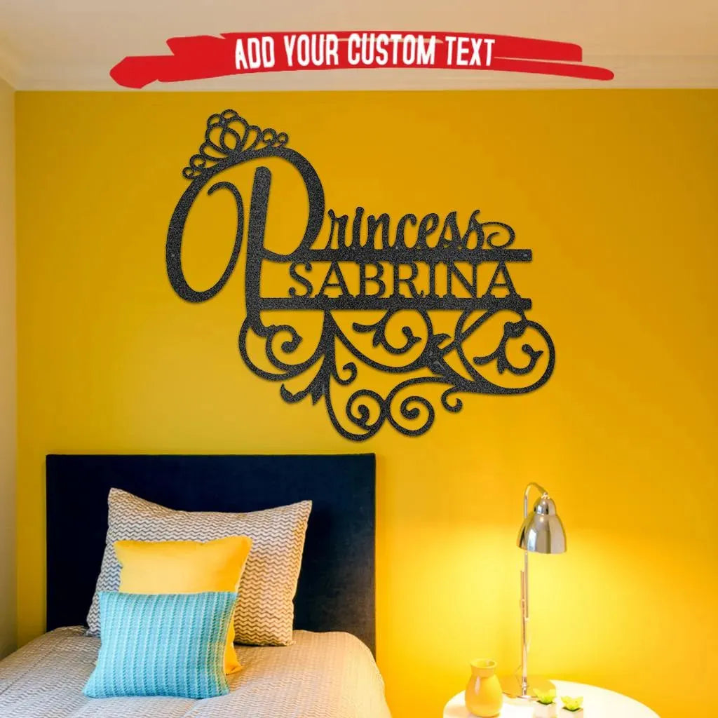 Black custom Princess Sabrina metal wall art with a crown and scrollwork, on a yellow wall above a bed.