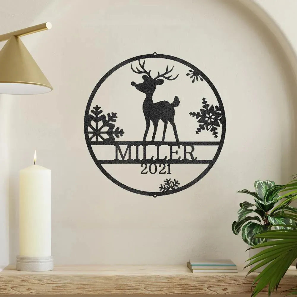 Black metal wall art with a reindeer, snowflakes, "MILLER", and "2021" in a circular design.