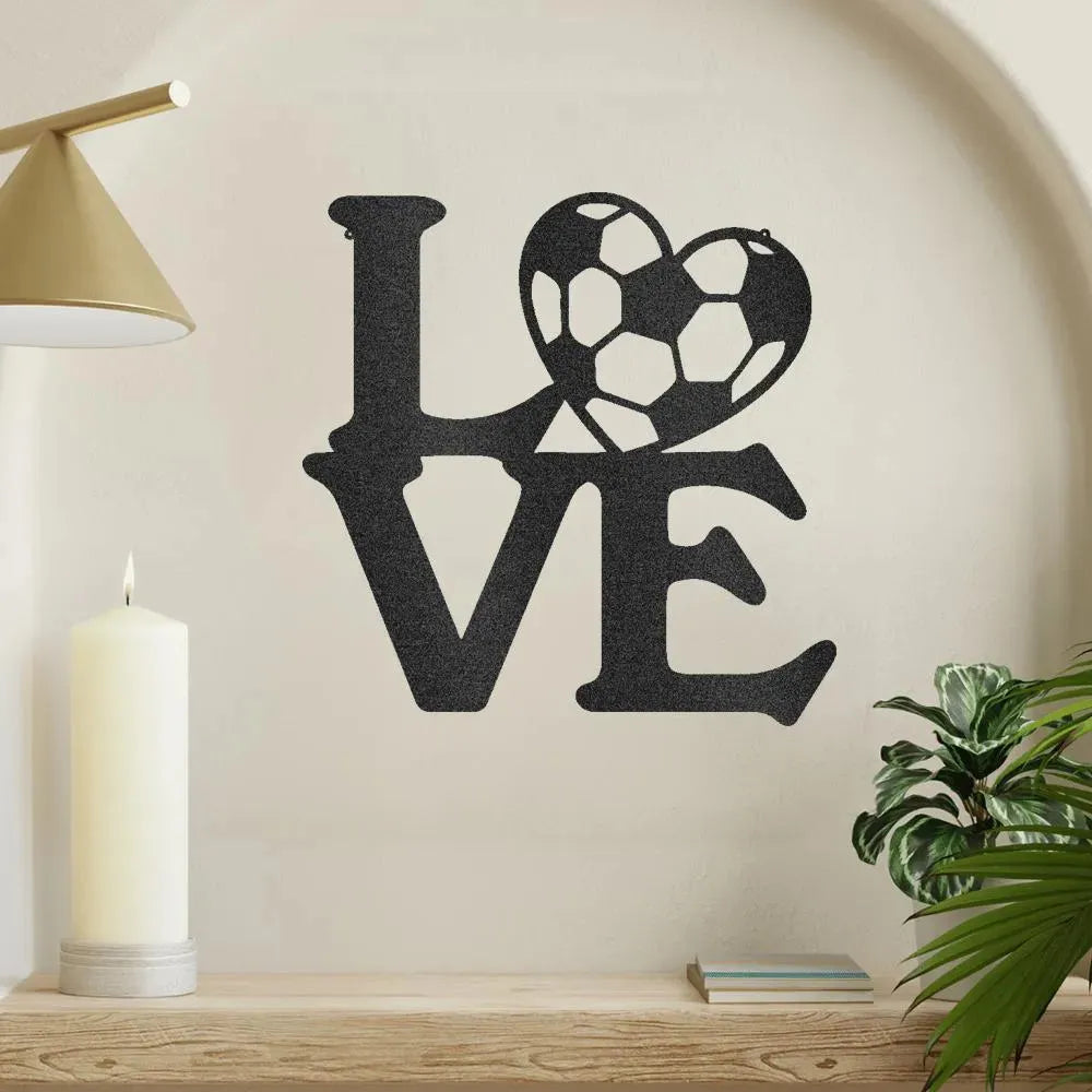 Black metal "LOVE" wall art with a soccer ball replacing the "O".