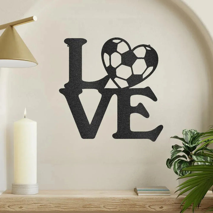 Black metal "LOVE" wall art with a soccer ball replacing the "O".