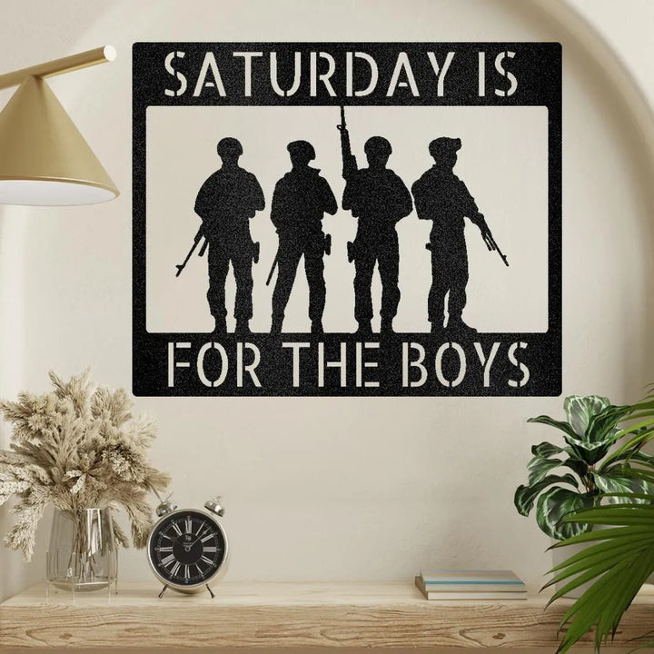 Black metal wall art with "SATURDAY IS FOR THE BOYS" text and four soldier silhouettes.