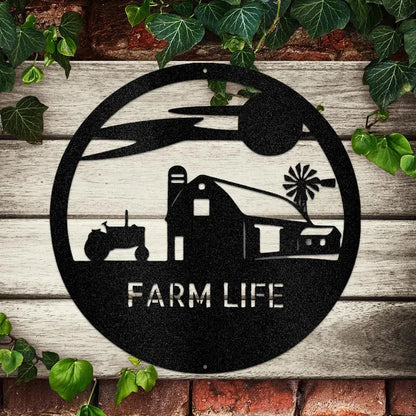 Black metal "Farm Life" monogram with barn, tractor, and windmill silhouette on a rustic wood and brick wall.