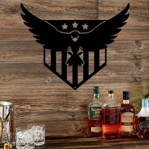 Black metal wall art of a swooping eagle with stars and stripes, mounted on a rustic wood wall.