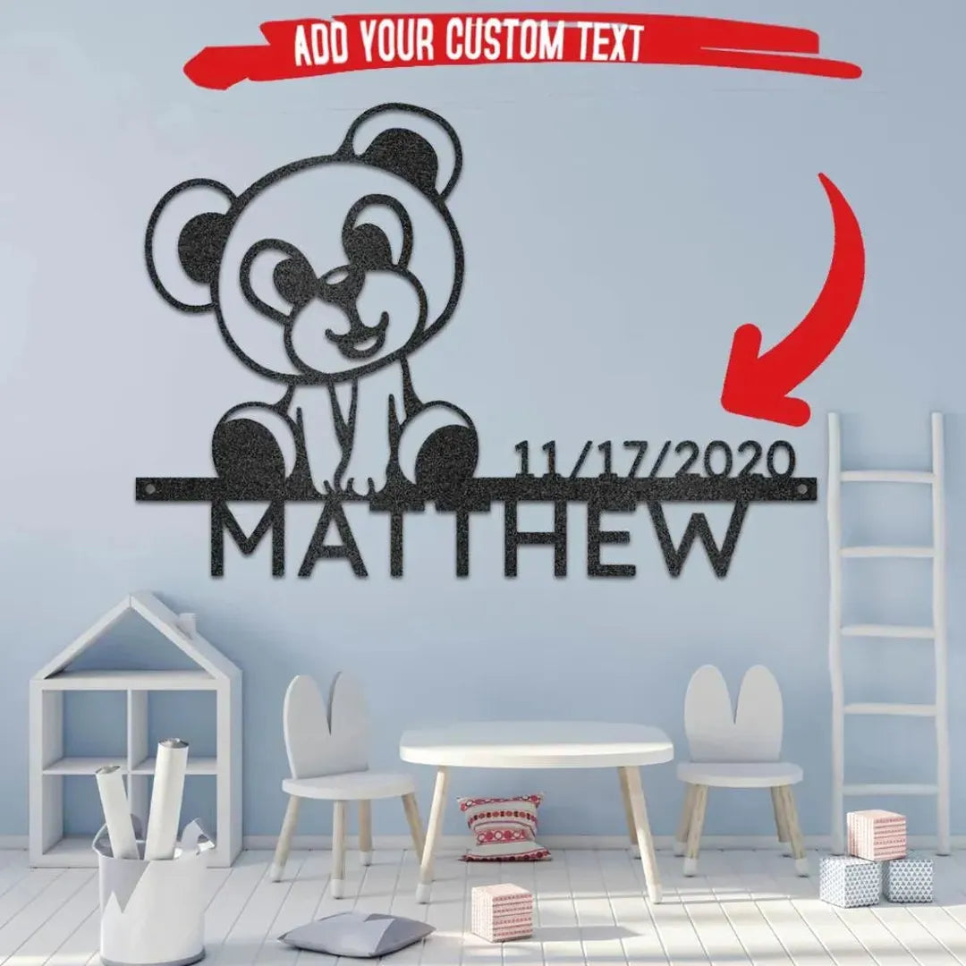 Black metal teddy bear monogram wall art with "Matthew" and a date, in a child's room.