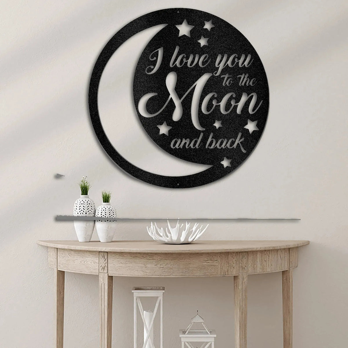 Black metal "I love you to the Moon and back" wall art with crescent moon and stars design.