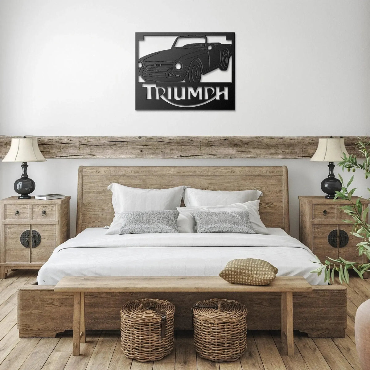 Bedroom with wooden bed, nightstands, and wall art of a Triumph car.