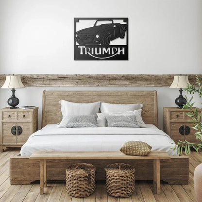 Bedroom with wooden bed, nightstands, and wall art of a Triumph car.