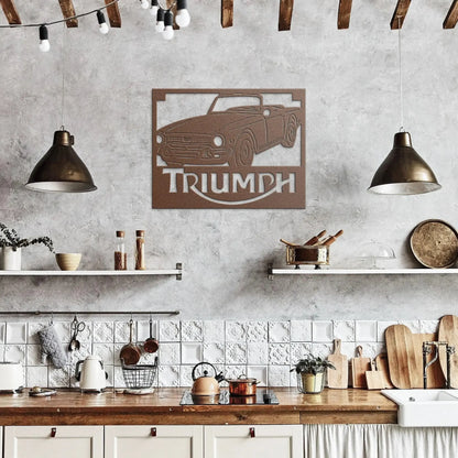 Kitchen interior with a Triumph car wall art piece on a gray wall.