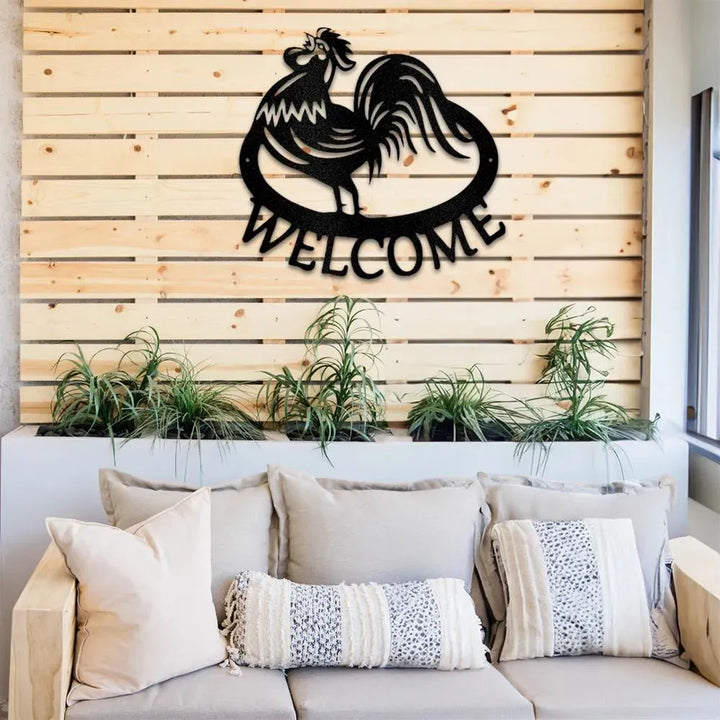 Black metal rooster "Welcome" wall art on a wooden slat wall above a couch.