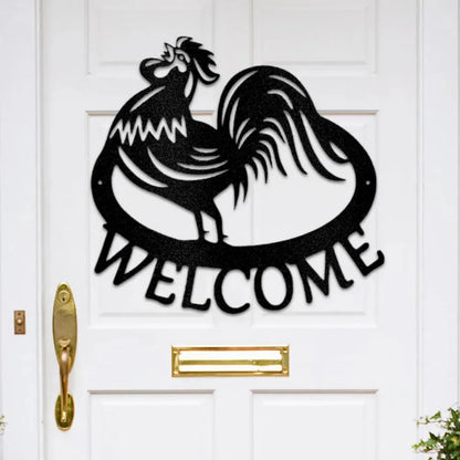 Black metal rooster "WELCOME" wall art on a white door.