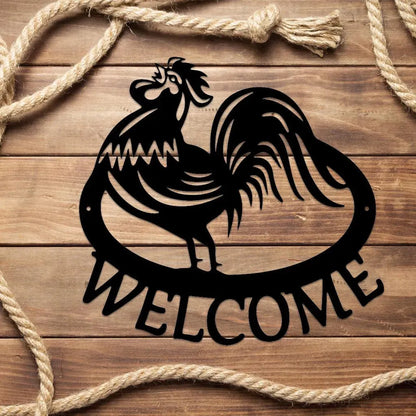 Black metal rooster "WELCOME" wall art on wood, framed by rope.